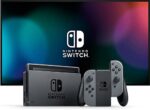 Nintendo Switch Konsole mit einem Paar grauer Joy-Con – Bild 2