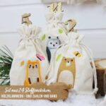 Papierdrachen Adventskalender 2026 – 24 bestickte Stoffsäckchen Waldtiere mit Glitzer-Zahlenklammern – Bild 2